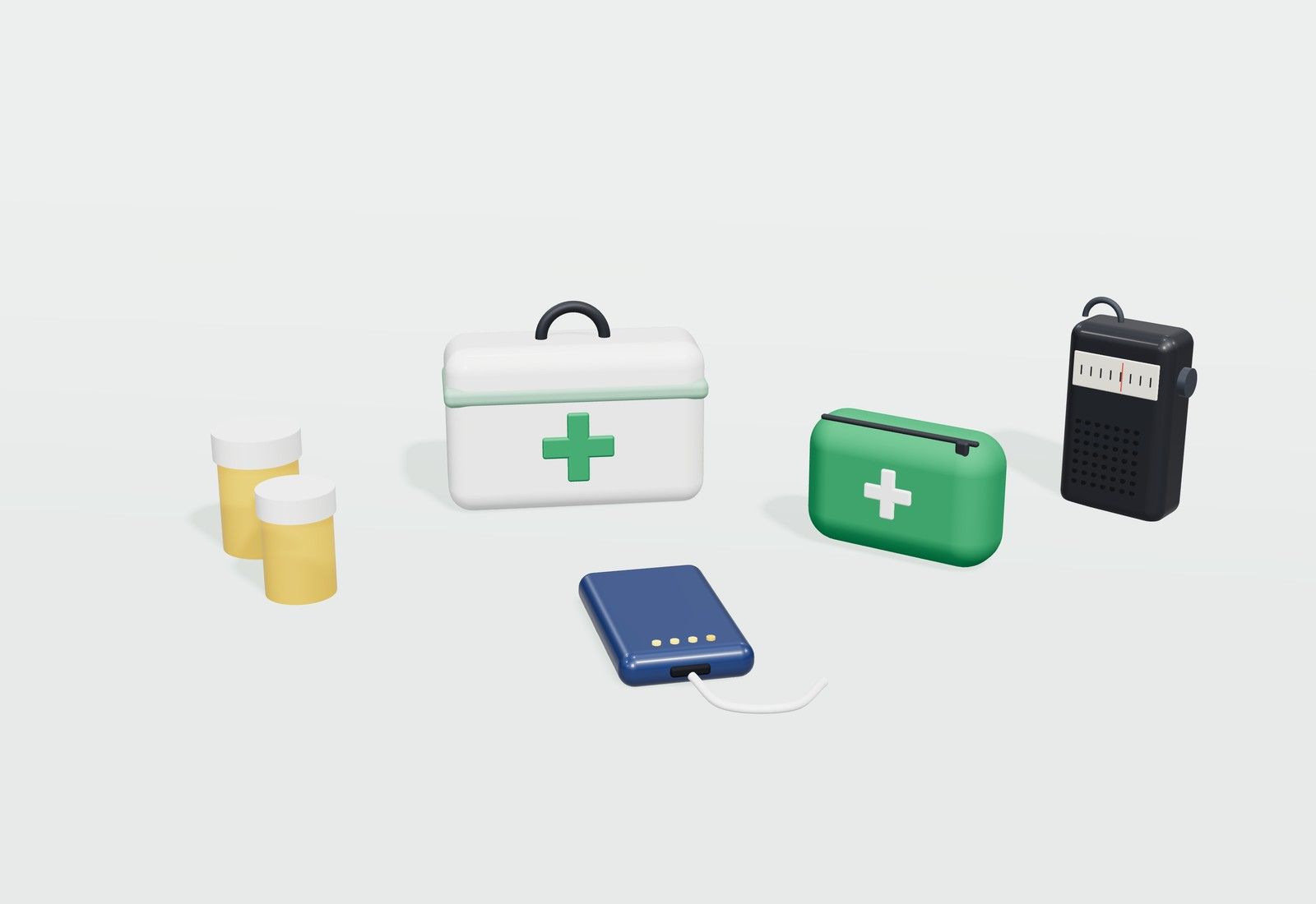 Botiquín blanco, un estuche verde de primeros auxilios, botes de medicamentos, una radio de bolsillo y una batería externa.